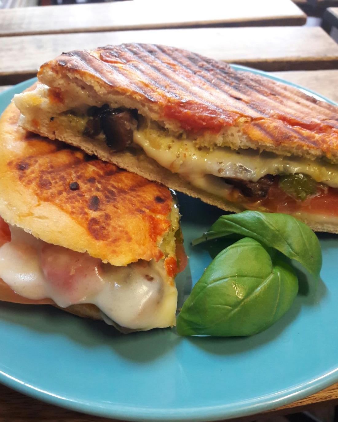 A toasted panini with basil